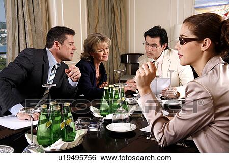 Business people having a meeting  View Large Photo Image Stock Photograph - Business people having a meeting . Fotosearch