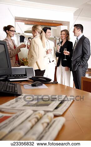 Stock Image - Bussiness people having a meeting. Fotosearch
