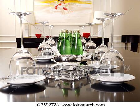 Stock Image - Conference table with water and glasses set up. Fotosearch