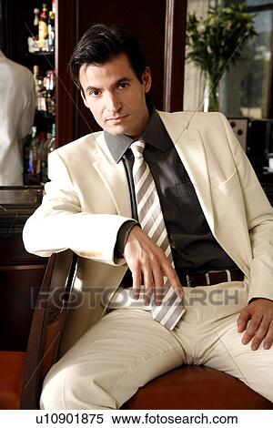 Stock Photography - Man sitting at a bar . Fotosearch