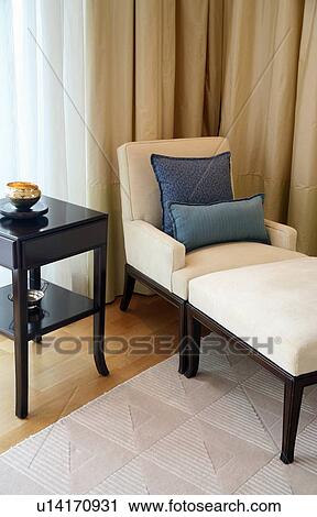 Stock Image - Armchair with sidetable. Fotosearch