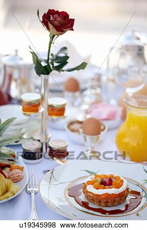 Stock Photo - Breakfast table with sweet tart. Fotosearch
