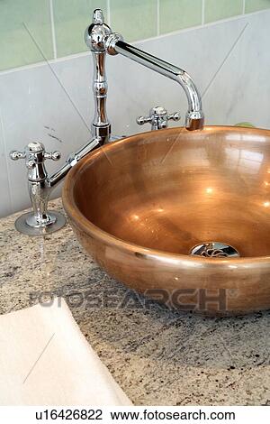 Stock Image - Copper bathroom sink. Fotosearch