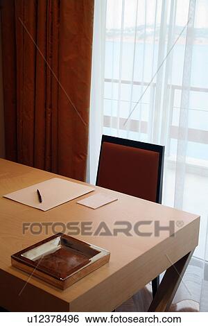 Desk with writing pad and pen View Large Photo Image Stock Photograph - Desk with writing pad and pen. Fotosearch