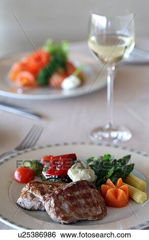 Meat dish on dinner table View Large Photo Image Stock Photograph - Meat dish on dinner table. Fotosearch