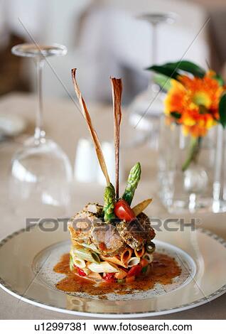 Stock Image - Stylized vegetable tuna pasta plate. Fotosearch