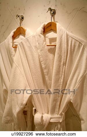 Stock Photograph - Two hanging bathrobes. Fotosearch