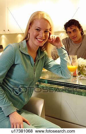 Stock Photo - Woman having a refreshment at the bar after a spa treatment. Fotosearch