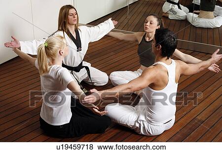 Participants in a fitness class practicing breathing exercises View Large Photo Image Stock Photo - Participants in a fitness class practicing breathing exercises. Fotosearch