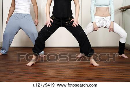Stock Photo - Students in an Active Tae Bo class, waist down. Fotosearch