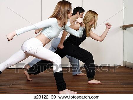 Students learning a basic Capoeira move View Large Photo Image Stock Photo - Students learning a basic Capoeira move. Fotosearch
