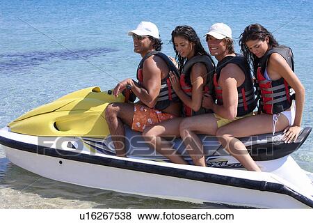 Two couples on jetski View Large Photo Image Stock Photo - Two couples on jetski. Fotosearch