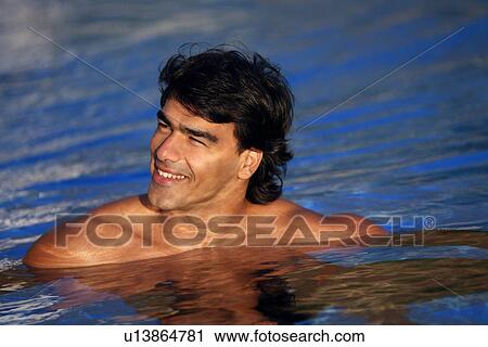 Stock Image - Man in swimming pool. Fotosearch