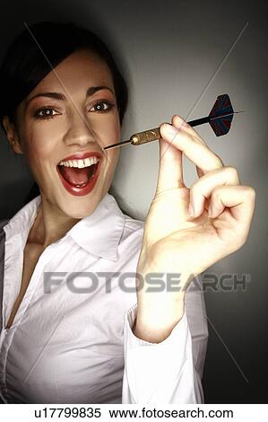 Office worker holding a dart View Large Photo Image Stock Photography - Office worker holding a dart. Fotosearch