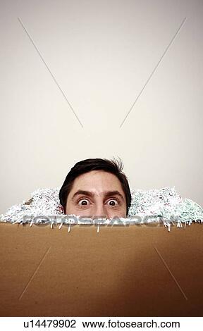 Office worker with head in a box View Large Photo Image Stock Image - Office worker with head in a box. Fotosearch