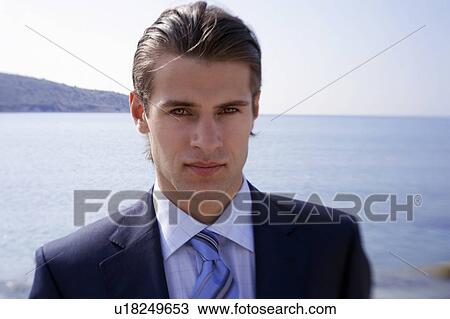 Stock Image - Businessman on the beach. Fotosearch