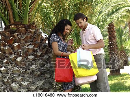 Couple with shopping bags View Large Photo Image Stock Image - Couple with shopping bags. Fotosearch
