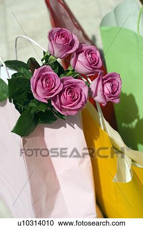 Stock Image - Shopping bags and roses. Fotosearch