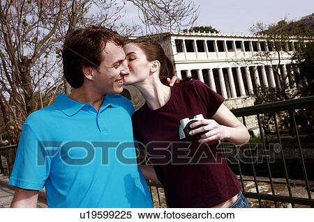 Stock Photography - Couple at archaeological site with binoculars. Fotosearch