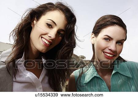 Stock Photo - Two women smiling. Fotosearch