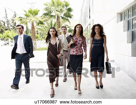 Stock Photo - Group of business people walking. Fotosearch