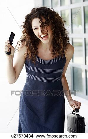 Happy businesswoman with cell phone View Large Photo Image Picture - Happy businesswoman with cell phone. Fotosearch