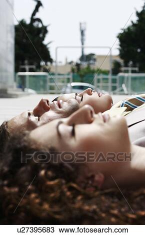 Heads of business people lying on the ground View Large Photo Image Stock Image - Heads of business people lying on the ground. Fotosearch