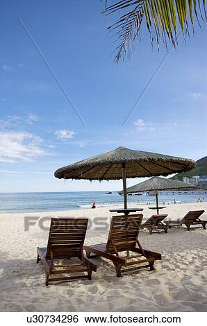 Beach chair and sunshade on beach View Large Photo Image Stock Photograph - Beach chair and sunshade on beach. Fotosearch