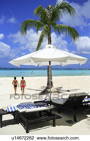 Beach chairs and sunshade on beach of Boracay island View Large Photo Image Stock Image - Beach chairs and sunshade on beach of Boracay island. Fotosearch