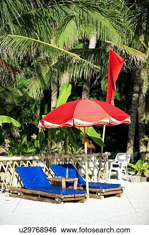 Red sunshade and beach chairs on beach View Large Photo Image Stock Photograph - Red sunshade and beach chairs on beach. Fotosearch