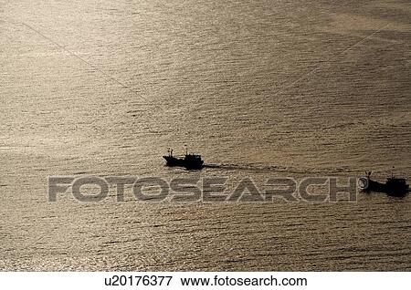 Scene of sea at the sunset, Sanya City, Hainan Province, China View Large Photo Image Stock Photo - Scene of sea at the sunset, Sanya City, Hainan Province, China. Fotosearch