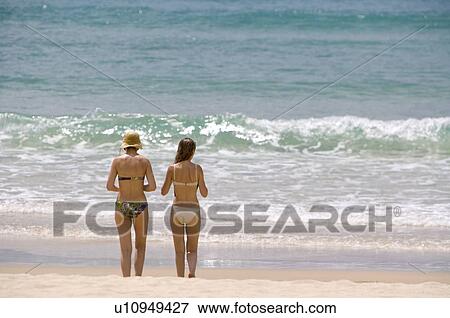 Stock Photo - Women standing on the seaside. Fotosearch