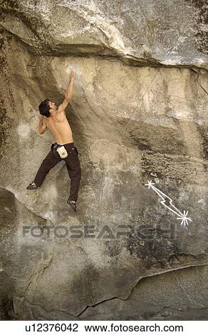 Man (25-30) climbing Midnight Lightning, a classic boulder climb. Yosemite National Park, California, USA View Large Photo Image Stock Image - Man (25-30) climbing Midnight Lightning, a classic boulder climb. Yosemite National Park, California, USA. Fotosearch