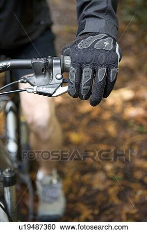 Stock Image - Mountain biker hand and hand brake, Stanley Park, Vancouver, BC, Canada. Fotosearch