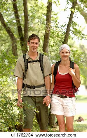 Young couple hiking in woods, Regina, Saskatchewan View Large Photo Image Picture - Young couple hiking in woods, Regina, Saskatchewan. Fotosearch