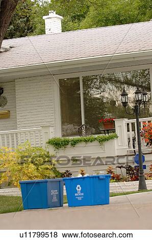 Blue recycling bins in front of house, Regina, Saskatchewan View Large Photo Image Stock Photo - Blue recycling bins in front of house, Regina, Saskatchewan. Fotosearch