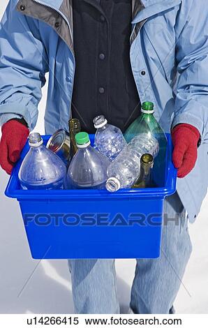 Homemaker taking out "Blue Bin" full of bottles and cans for recycling. View Large Photo Image Stock Photography - Homemaker taking out "Blue Bin" full of bottles and cans for recycling.. Fotosearch
