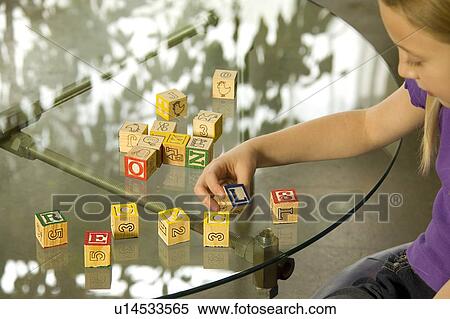 Young Girl spelling recycle with alphabet blocks View Large Photo Image Stock Photography - Young Girl spelling recycle with alphabet blocks. Fotosearch