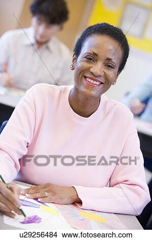 Adult student in class drawing View Large Photo Image Picture - Adult student in class drawing. Fotosearch
