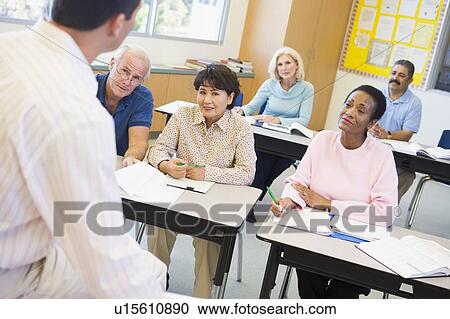 Adult students in class with teacher (selective focus) View Large Photo Image Stock Image - Adult students in class with teacher (selective focus). Fotosearch