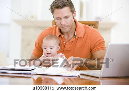 Father and baby in dining room with laptop View Large Photo Image Stock Photography - Father and baby in dining room with laptop. Fotosearch