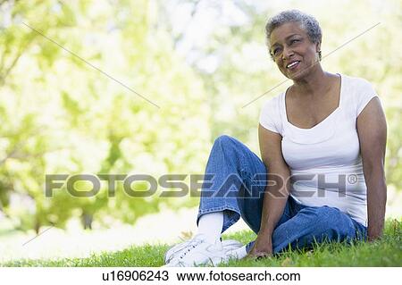 Senior woman resting in a park View Large Photo Image Stock Image - Senior woman resting in a park. Fotosearch