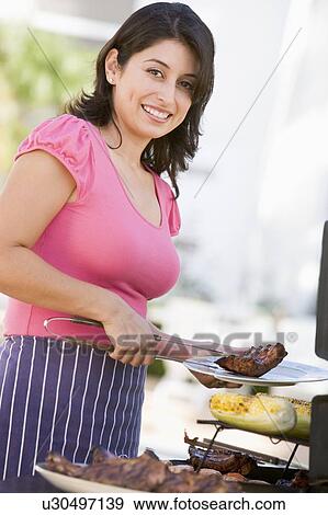 Woman Cooking On A Barbeque View Large Photo Image Stock Photo - Woman Cooking On A Barbeque. Fotosearch