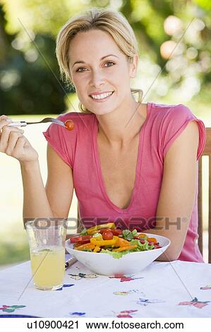 Woman Enjoying A Salad In A Garden View Large Photo Image Stock Image - Woman Enjoying A Salad In A Garden. Fotosearch