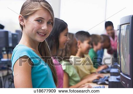 Six children at computer terminals with teacher in background (depth of field/high key) View Large Photo Image Stock Photo - Six children at computer terminals with teacher in background (depth of field/high key). Fotosearch