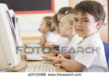 Students in class at computer terminals (depth of field) View Large Photo Image Stock Photo - Students in class at computer terminals (depth of field). Fotosearch