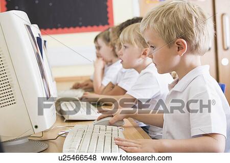 Students in class at computer terminals (depth of field) View Large Photo Image Stock Photo - Students in class at computer terminals (depth of field). Fotosearch