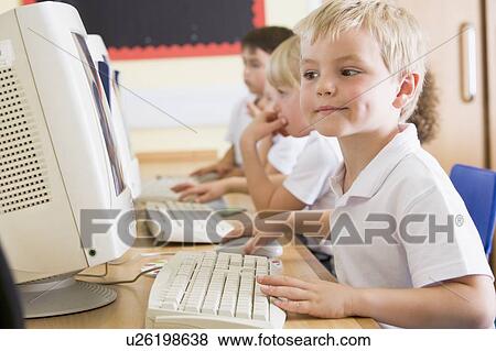 Students in class at computer terminals (depth of field) View Large Photo Image Stock Photo - Students in class at computer terminals (depth of field). Fotosearch