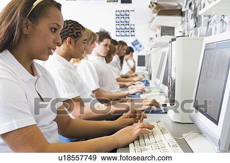 Students working on computer workstations View Large Photo Image Stock Photo - Students working on computer workstations. Fotosearch