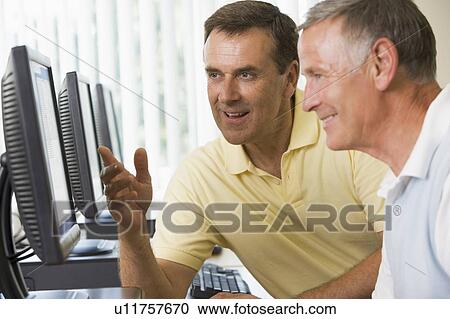 Two men at a computer terminal talking (depth of field/high key) View Large Photo Image Stock Image - Two men at a computer terminal talking (depth of field/high key). Fotosearch